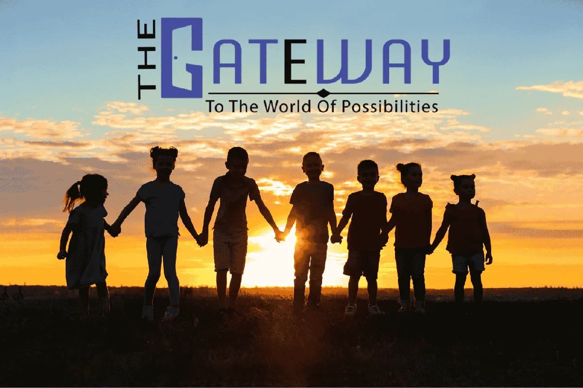 Children holding hands at sunset - The Gateway Institute
